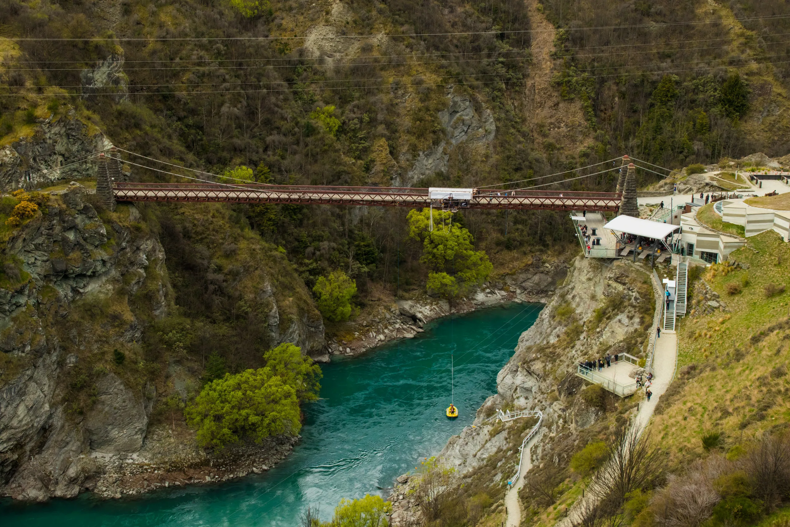The Kawarau Gorge suspension bridge spanning the turquoise river — the original AJ Hackett bungy site