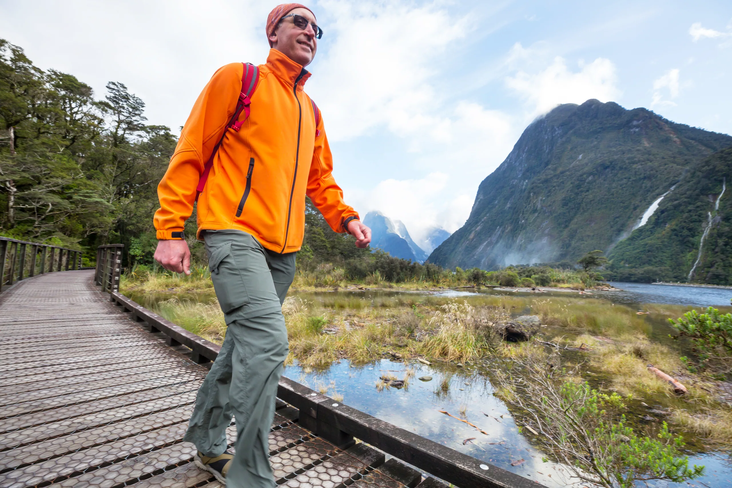 A Fiordland fjord with sheer mountain walls dropping to dark water — the same wilderness Doubtful Sound sits in