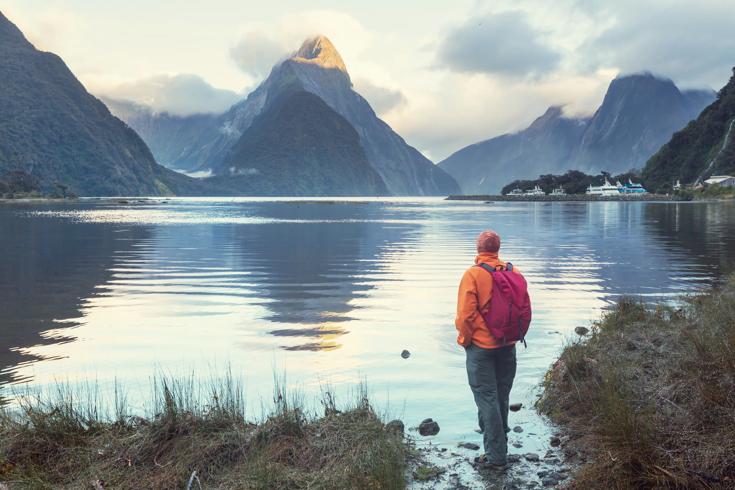 Milford Sound with Mitre Peak rising from the fjord and reflections across the dark water