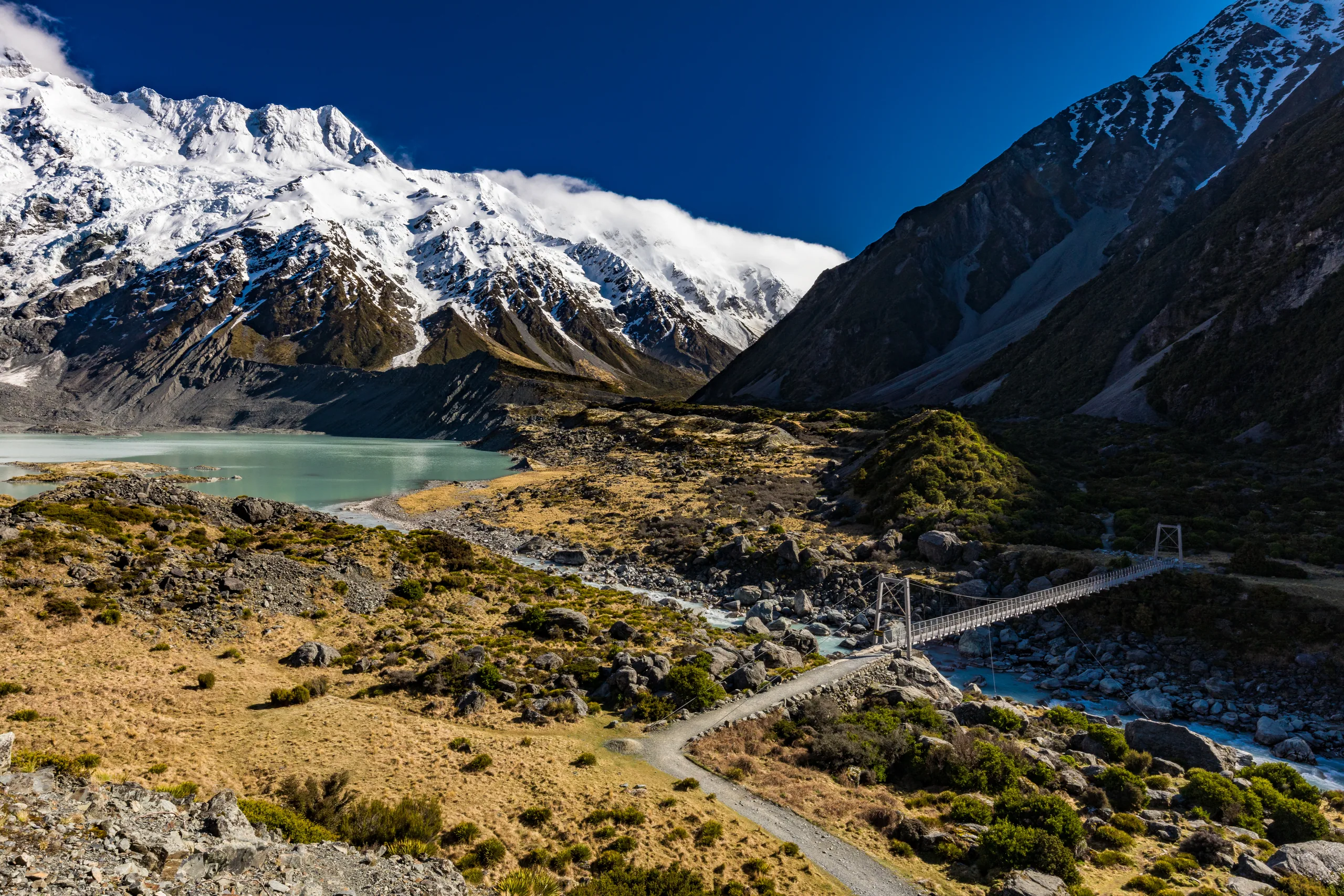 The turquoise water of Lake Pukaki with Aoraki Mt Cook framed at the far end of the lake