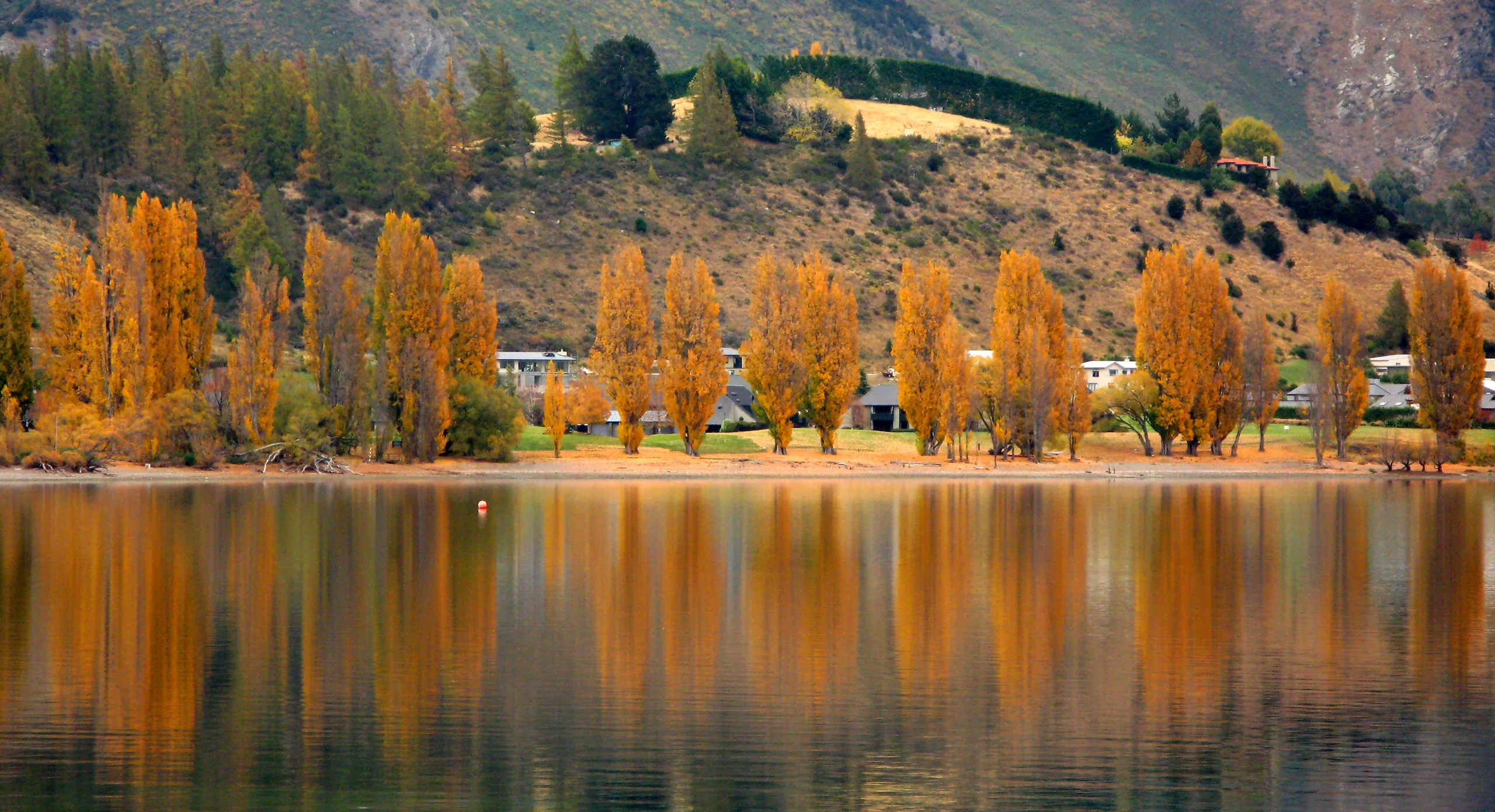 Lake Wanaka with snow-capped peaks — Southern Alps country that anchors a 14-day NZ trip