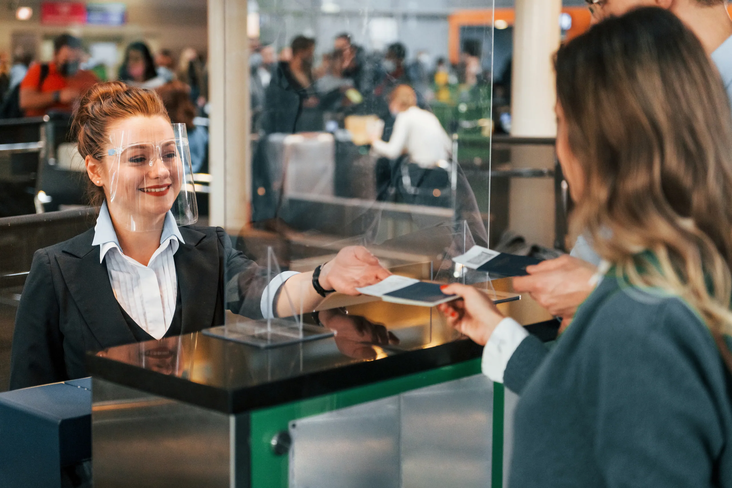 Travellers leaving the international arrivals hall at a New Zealand airport