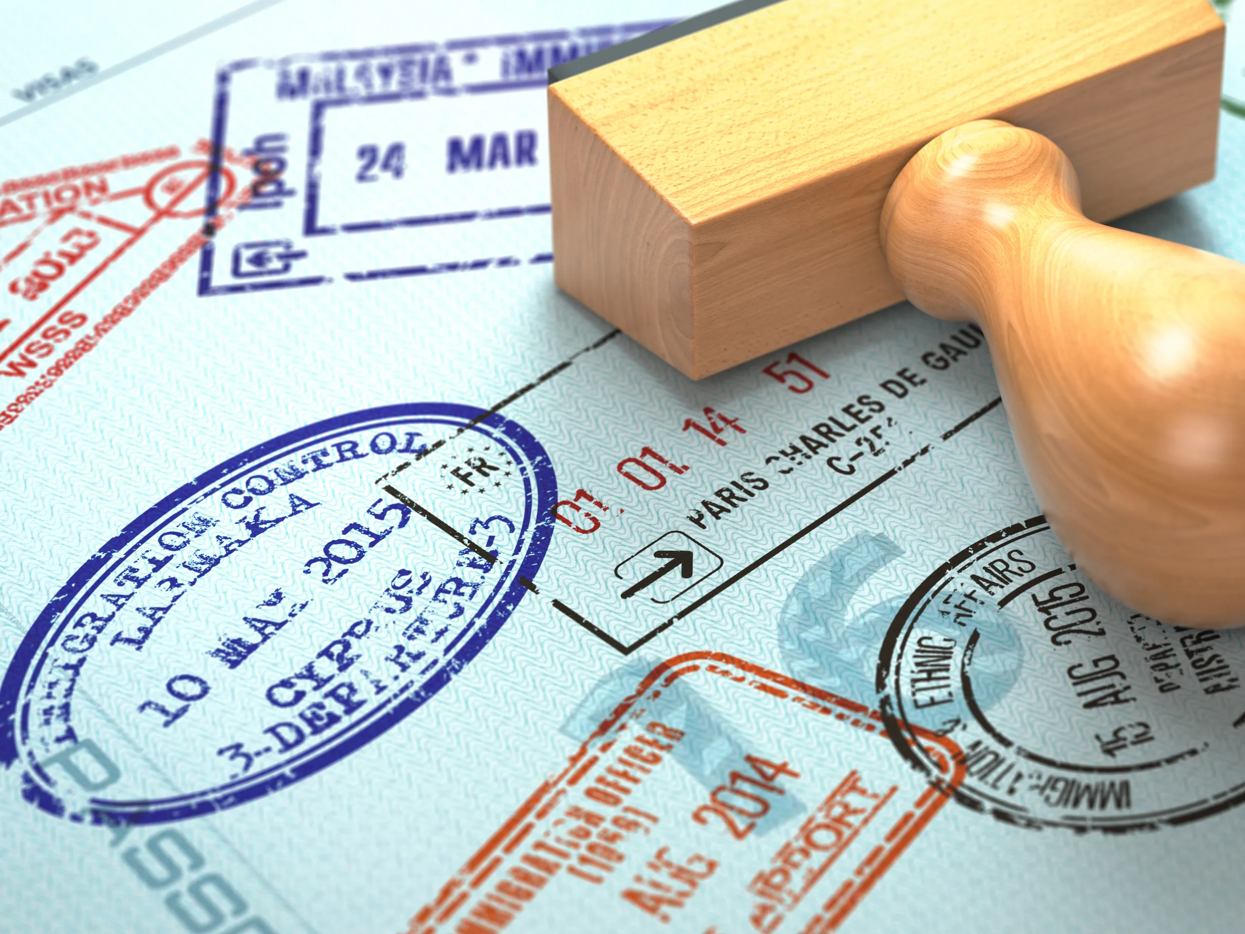 A passport open on a desk next to a boarding pass for New Zealand