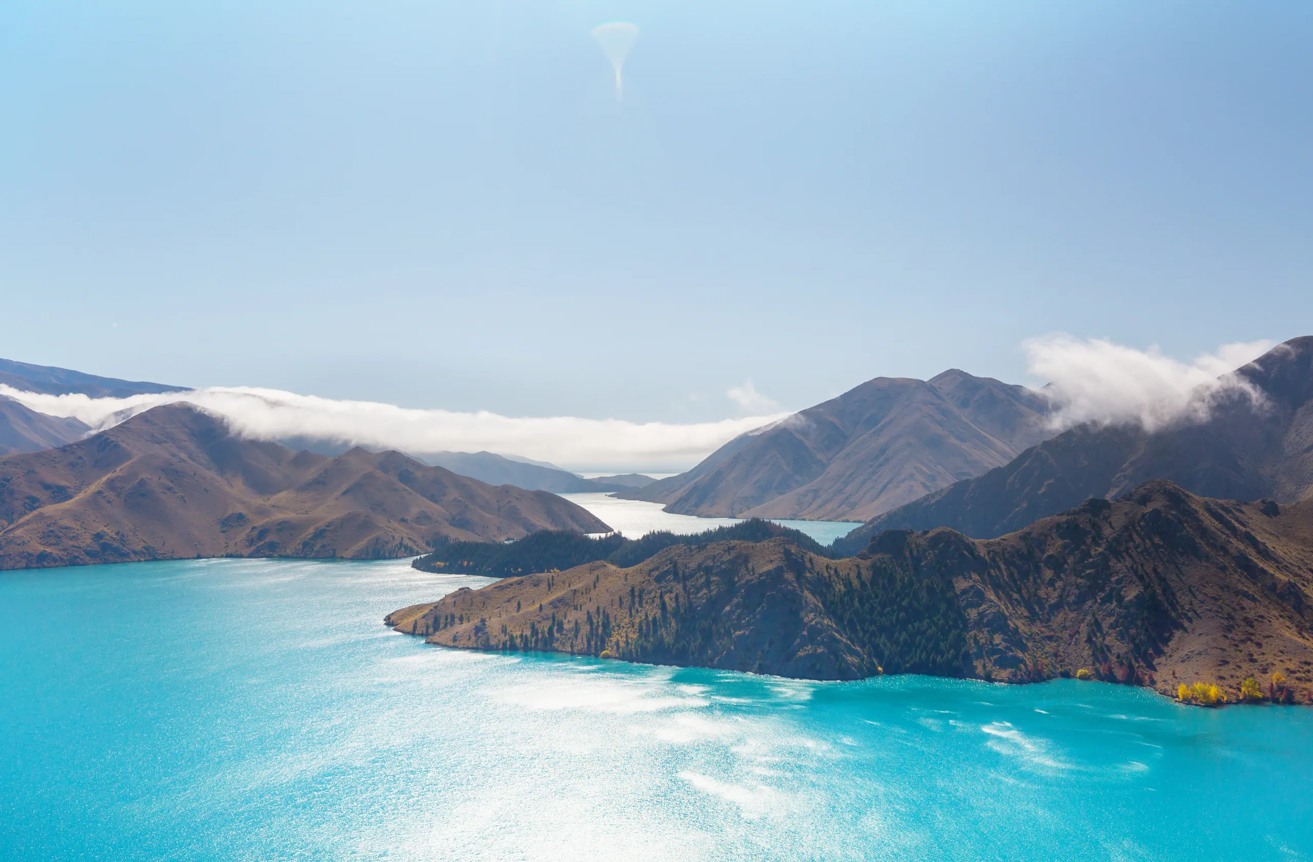 Sweeping New Zealand mountain and lake landscape — the kind of country a 10-day trip stitches together